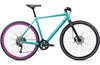 A turquoise and black city bicycle with a bright pink wheel rim, shown from a side profile on a white background.